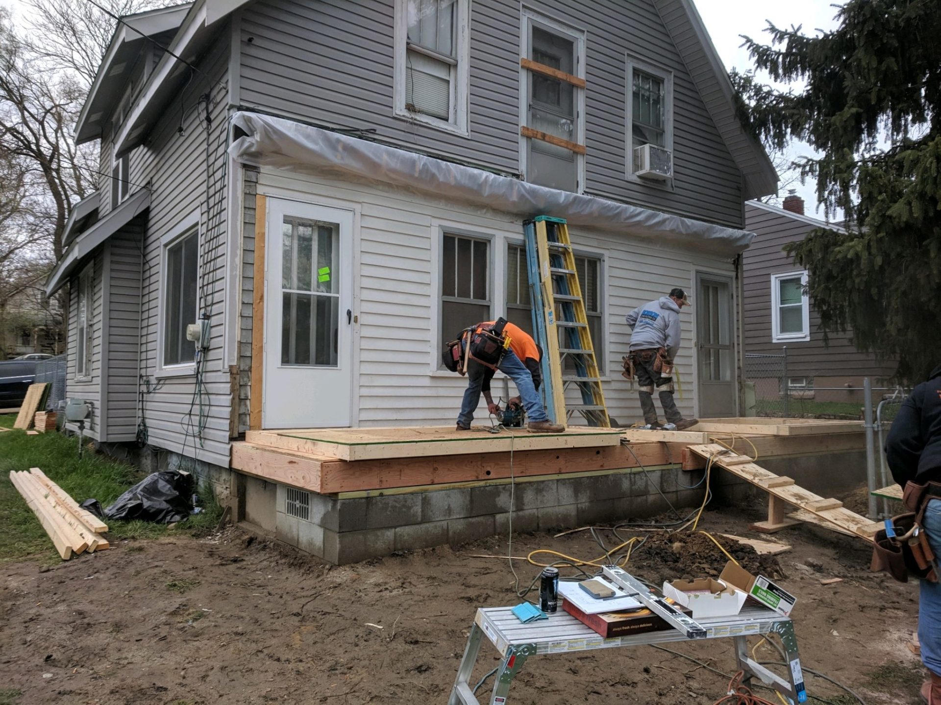 A front porch addition being framed in Pontiac