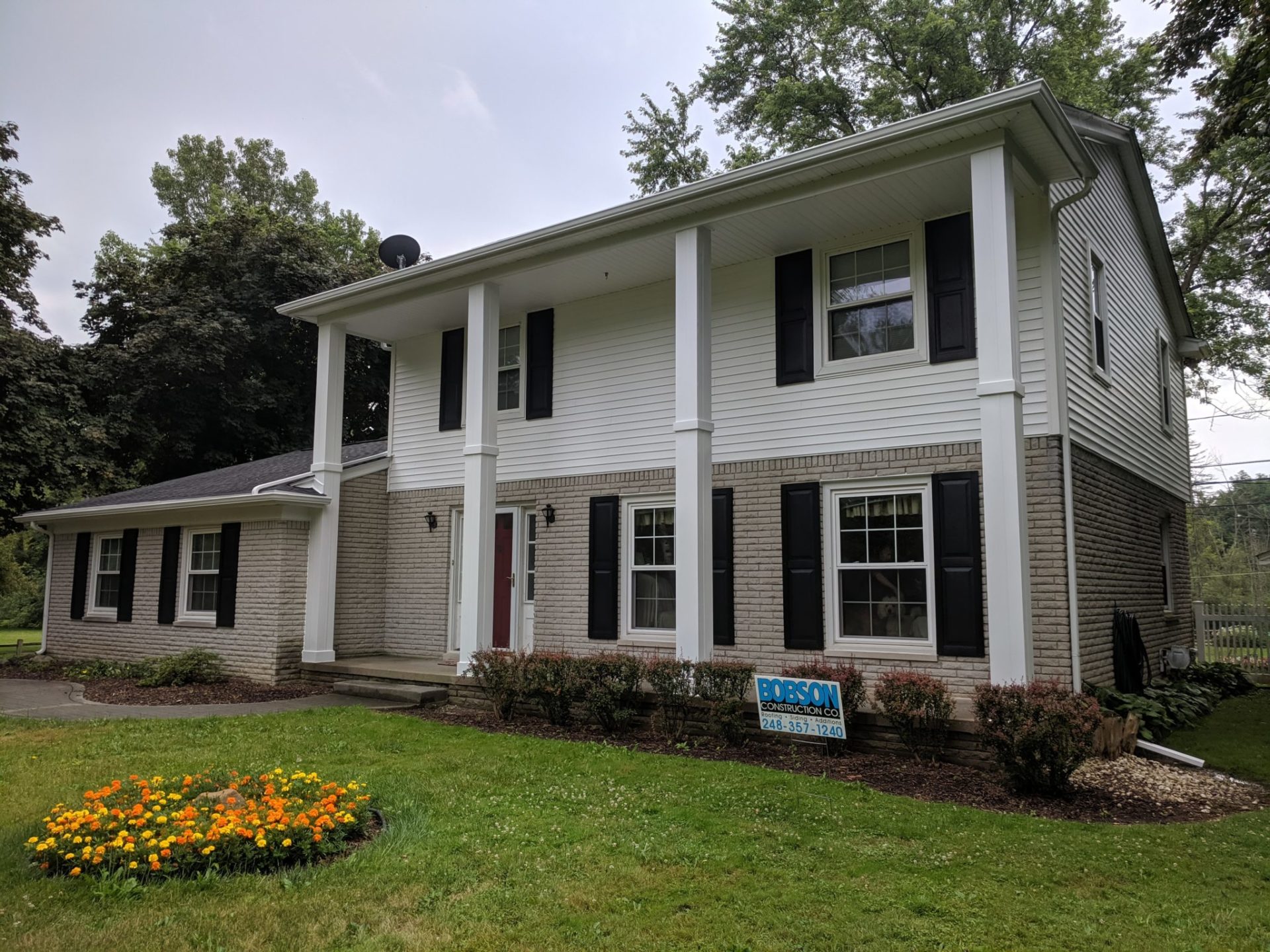 Home with new vinyl siding and aluminum gutters in Metro Detroit