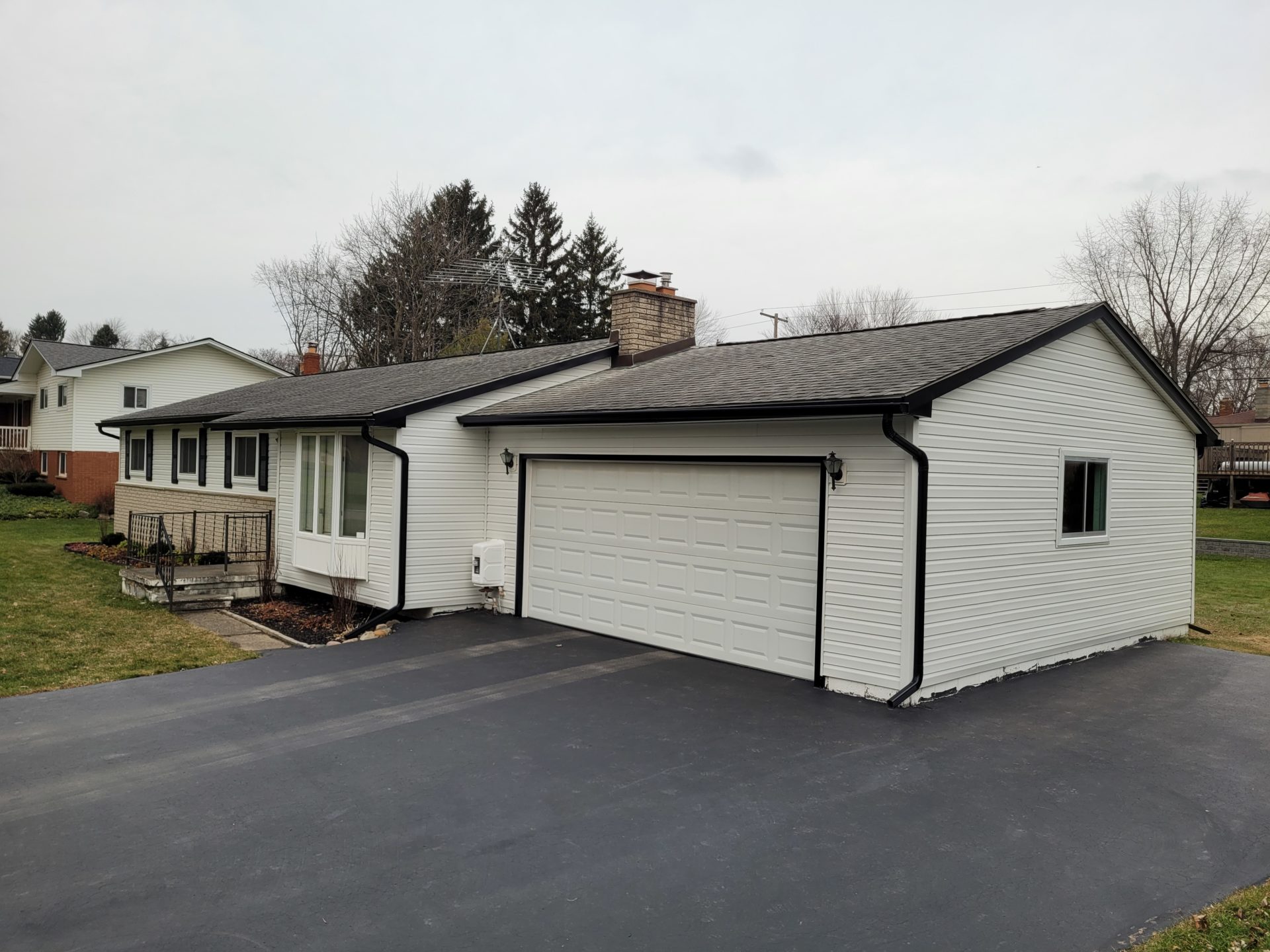 New vinyl siding, aluminum trim and aluminum gutters