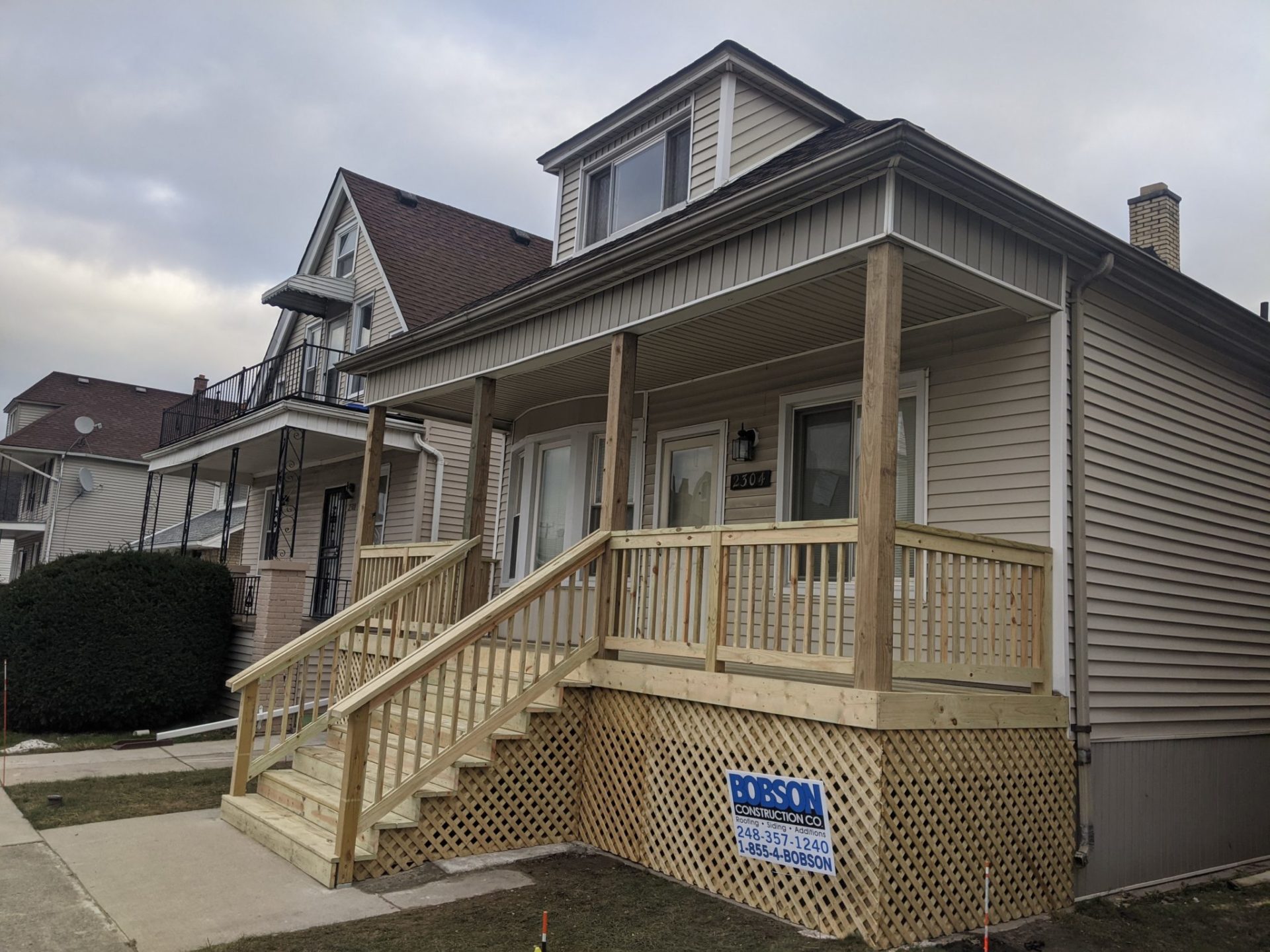 New treated-wood front porch in Hamtramck