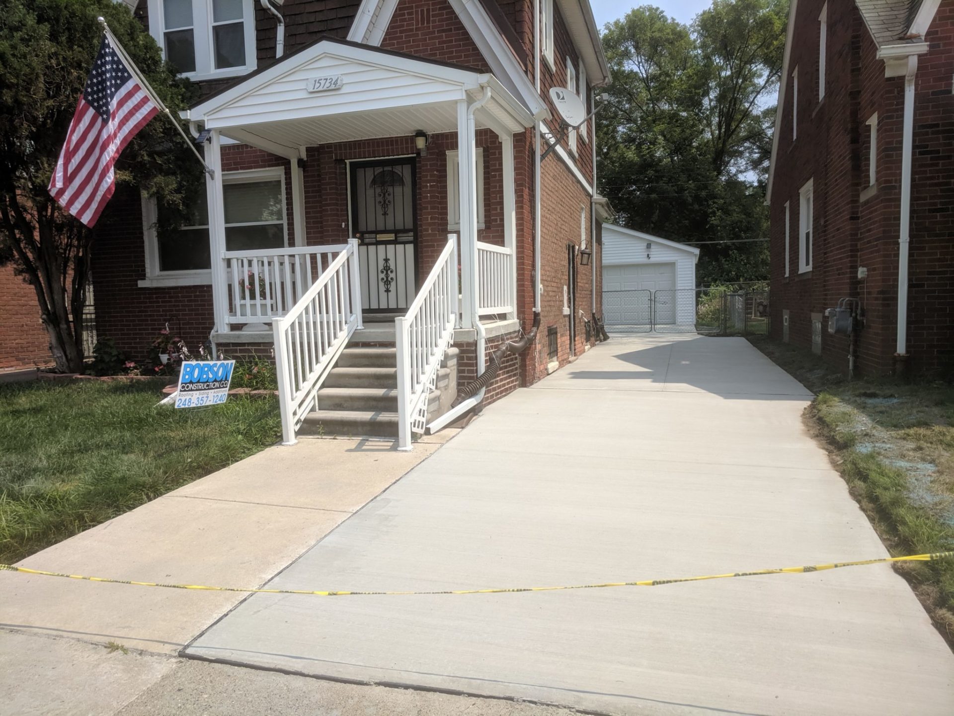 New concrete front porch with aluminum railings